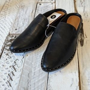 Black embellished backless loafers